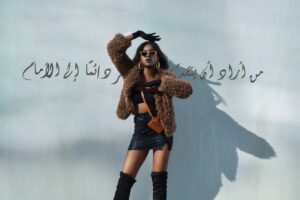 woman in brown coat and black boots