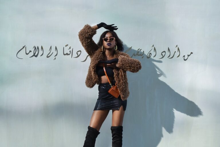 woman in brown coat and black boots