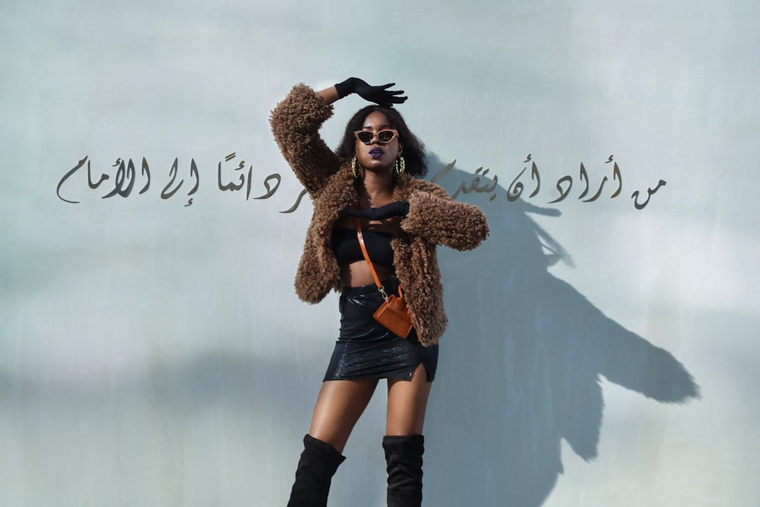 woman in brown coat and black boots