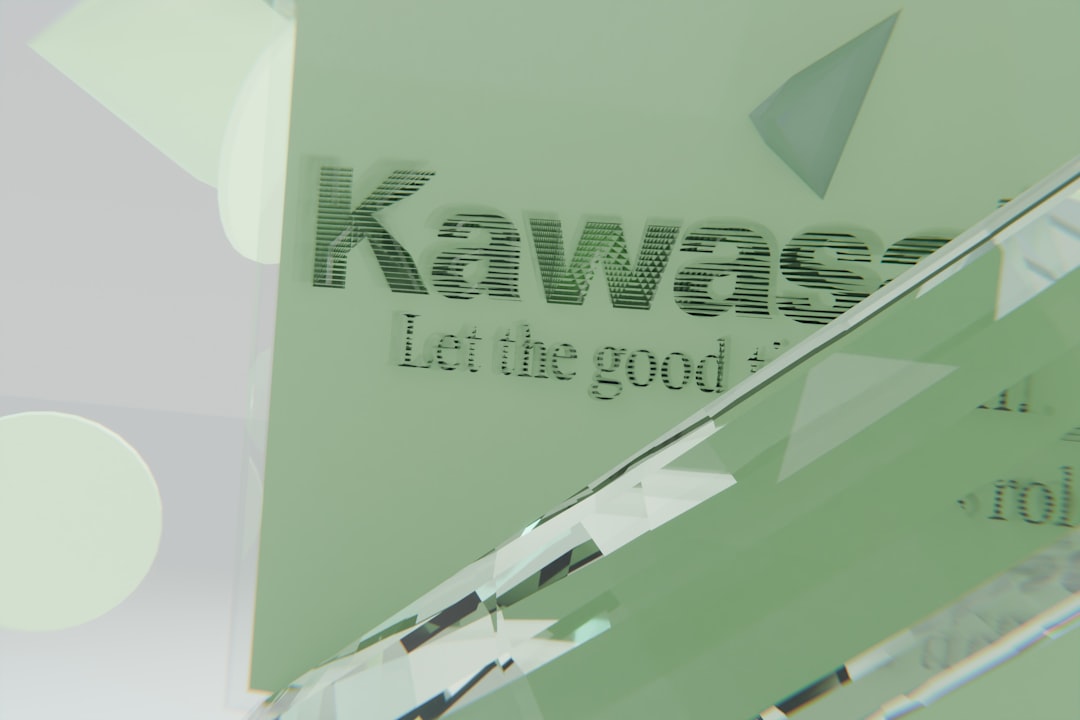 Light green surface displaying kawasaki text and geometric shapes.