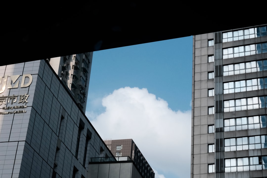 a couple of tall buildings next to each other