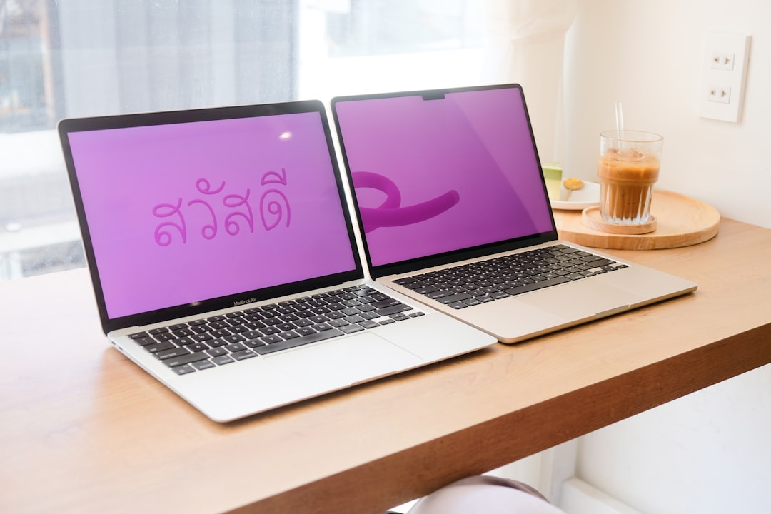 a couple of laptops on a table